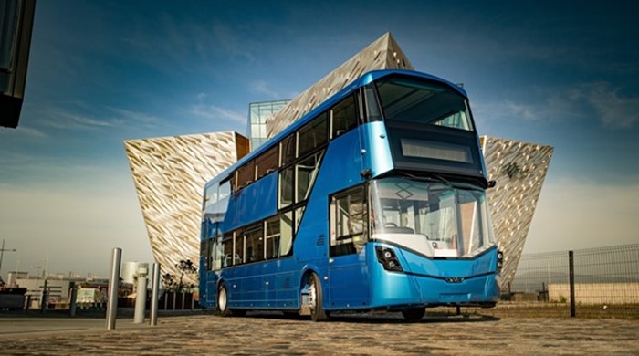 Wrightbus, Blue bus with modern architectural building behind the bus